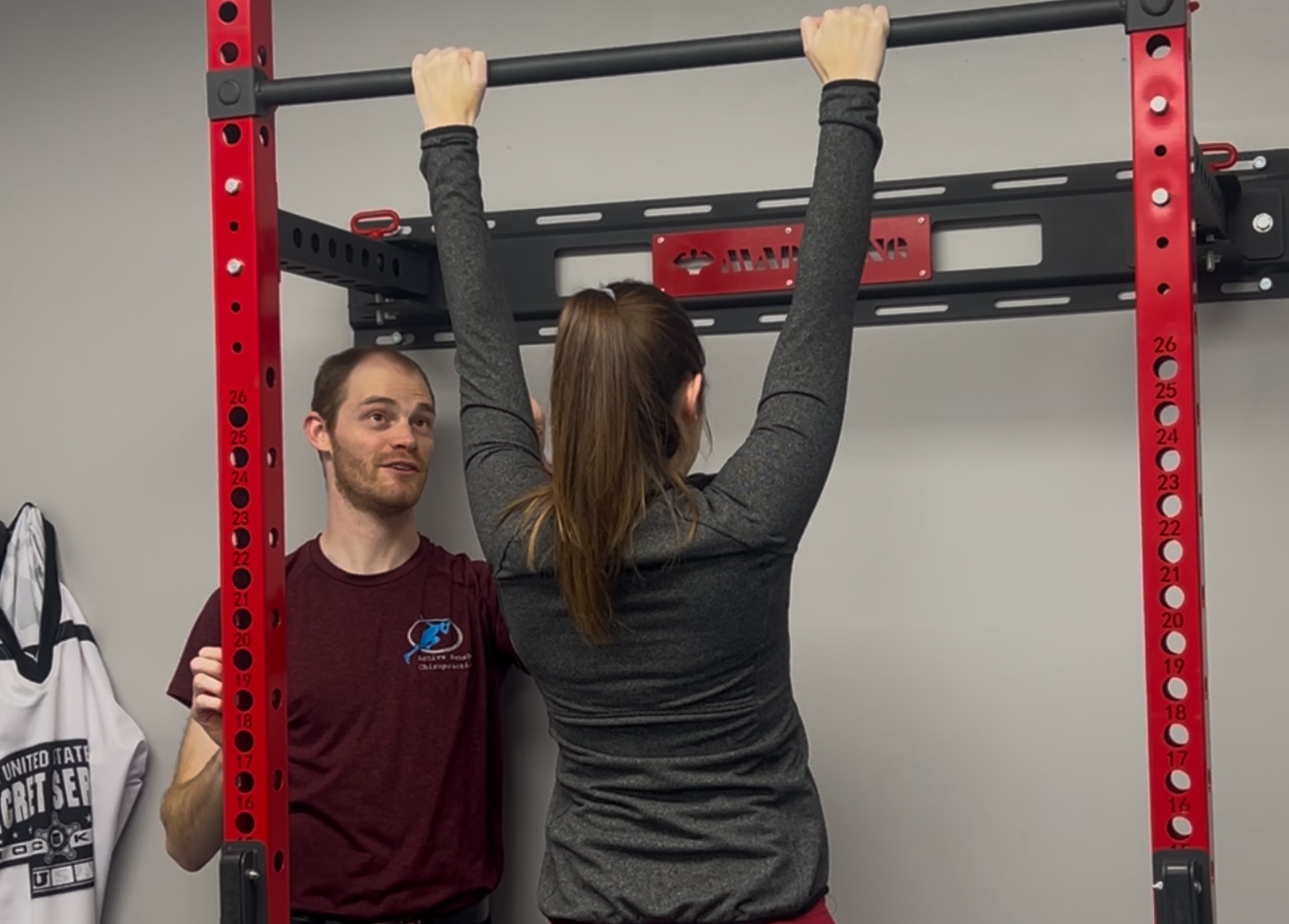 Patient performing overhead functional rehabilitation